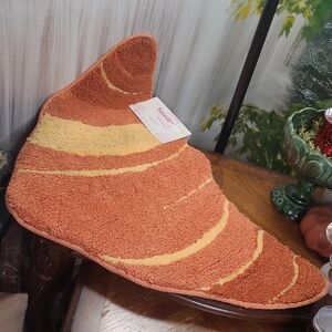 New with tags! Nature Step Croissant shaped decorative novelty floor rug